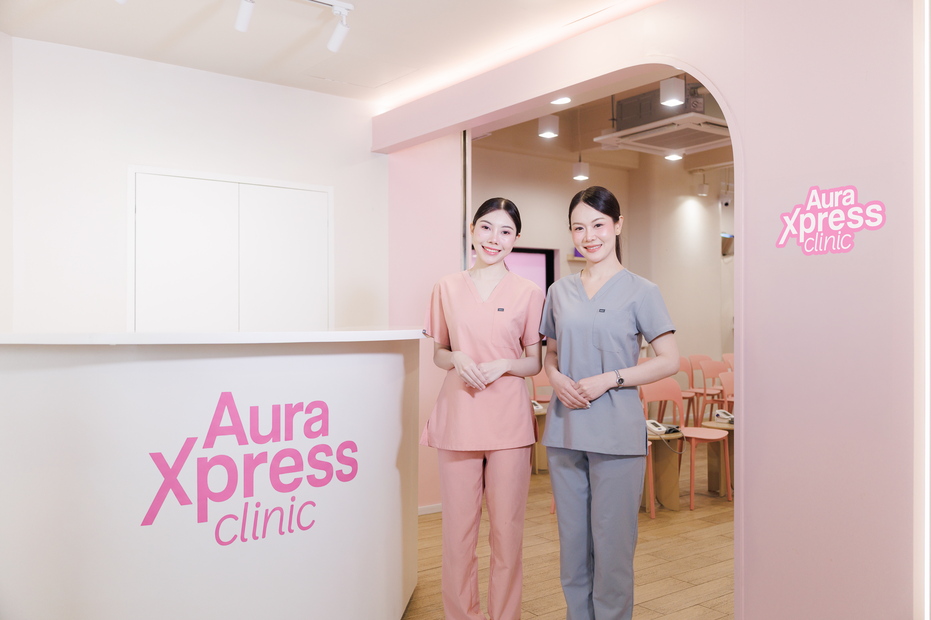 Xpress Clinic reception, with two staff members welcoming guests
