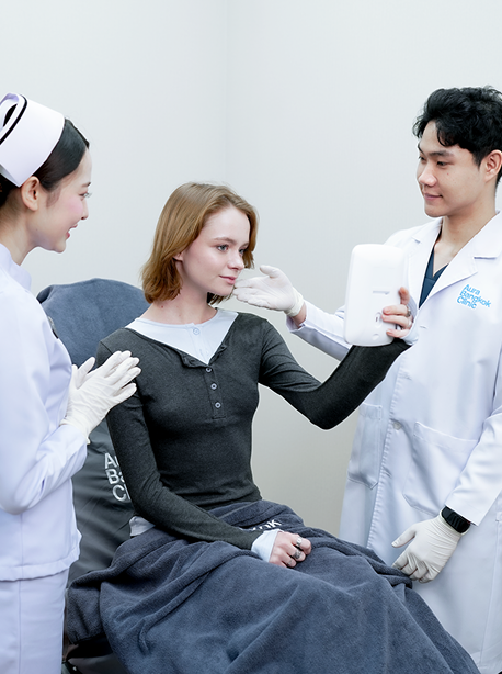 Doctor and nurse caring for a guest during a treatment